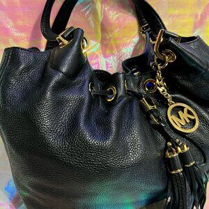 Michael Kors black leather hobo bag large tassels pebble grain gold trim